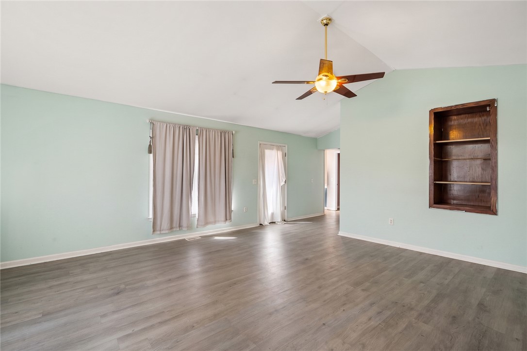 605 Sherry Drive Anderson, SC 29621 - Photo 19 of 36 This airy living space features a vaulted ceiling and durable flooring, perfect for relaxation and gatherings.