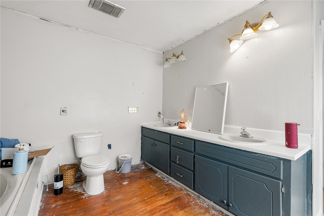 605 Sherry Drive Anderson, SC 29621 - Photo 20 of 36 This bathroom features hardwood flooring and a functional vanity with ample storage.