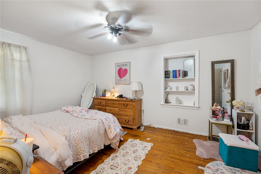 605 Sherry Drive Anderson, SC 29621 - Photo 22 of 36 This cozy bedroom features durable hardwood flooring and a ceiling fan, offering comfort and style.