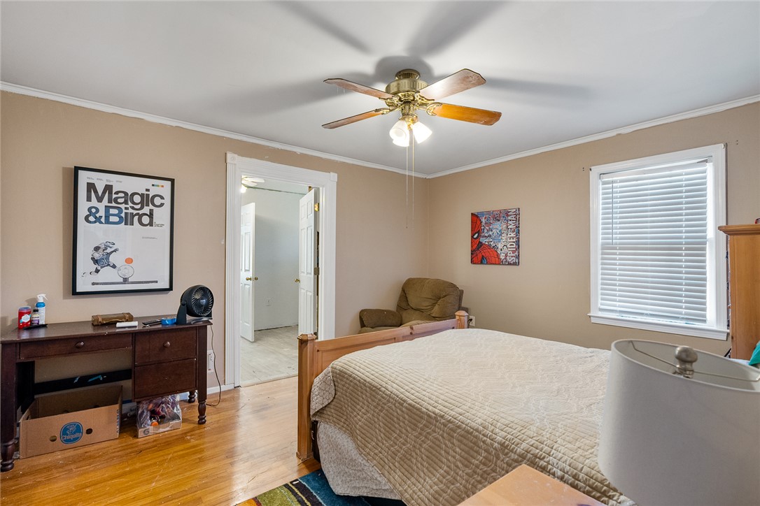 605 Sherry Drive Anderson, SC 29621 - Photo 28 of 36 This cozy bedroom features hardwood floors and a ceiling fan, creating a comfortable living space.