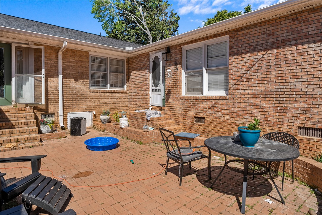 605 Sherry Drive Anderson, SC 29621 - Photo 31 of 36 This private outdoor retreat features a durable brick paver patio, perfect for entertaining.
