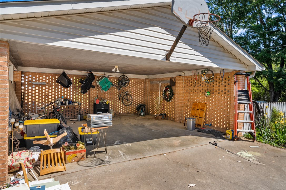 605 Sherry Drive Anderson, SC 29621 - Photo 32 of 36 This carport provides sheltered parking and additional storage options.