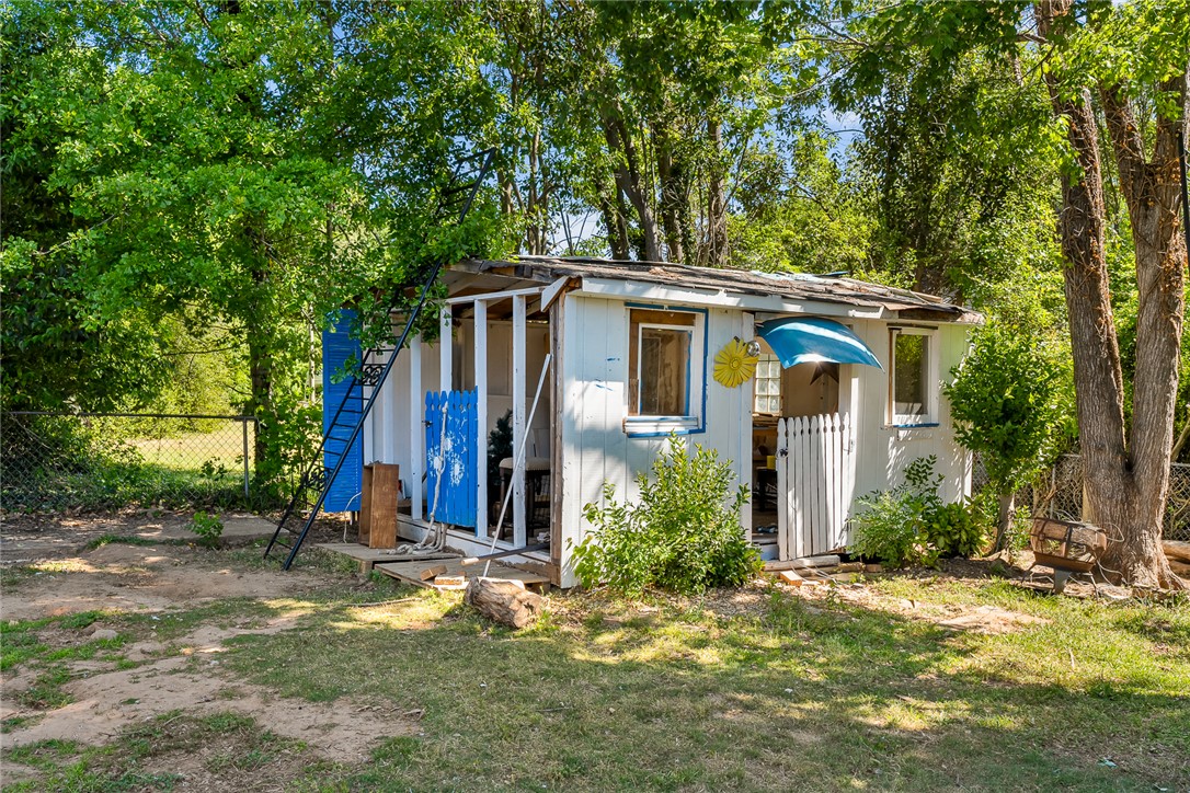 605 Sherry Drive Anderson, SC 29621 - Photo 33 of 36 This charming outbuilding offers a delightful retreat amidst lush greenery.