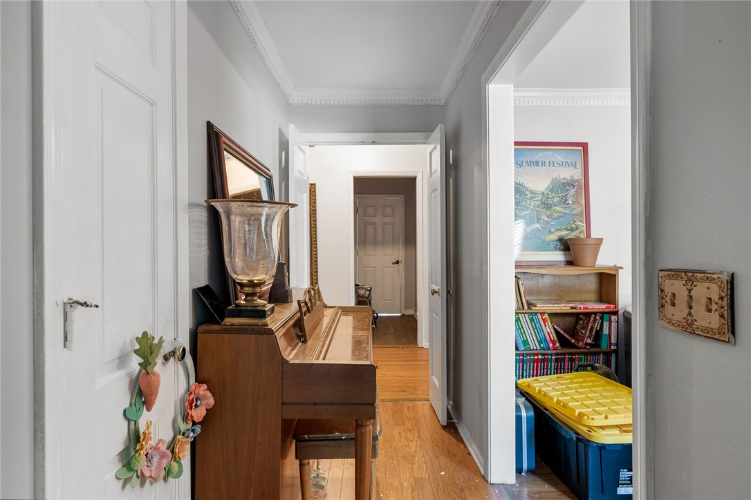 605 Sherry Drive Anderson, SC 29621 - Photo 4 of 36 This cozy hallway features classic hardwood flooring and detailed crown molding, creating a welcoming entrance.