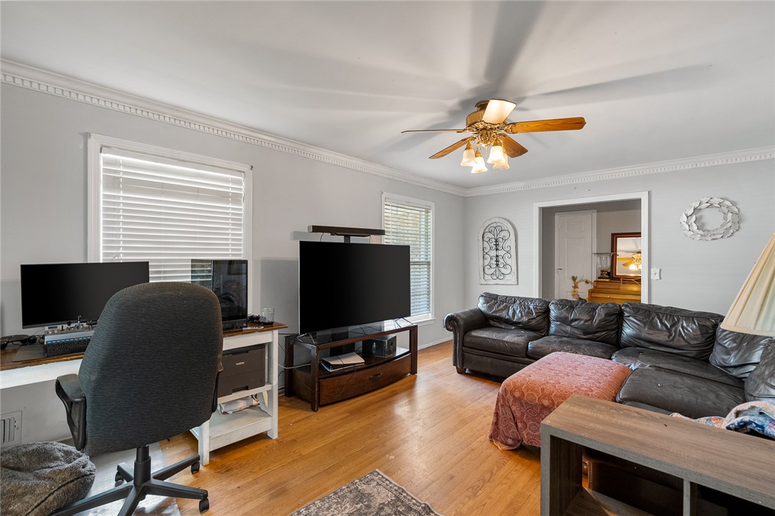 605 Sherry Drive Anderson, SC 29621 - Photo 7 of 36 This bright living space features elegant crown molding and rich hardwood flooring.