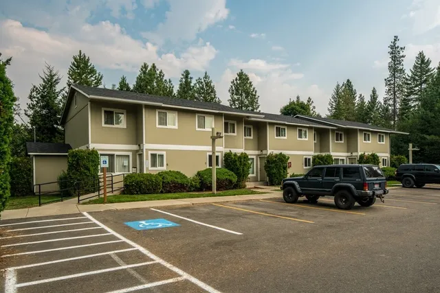 a view of a car parked in front of a house