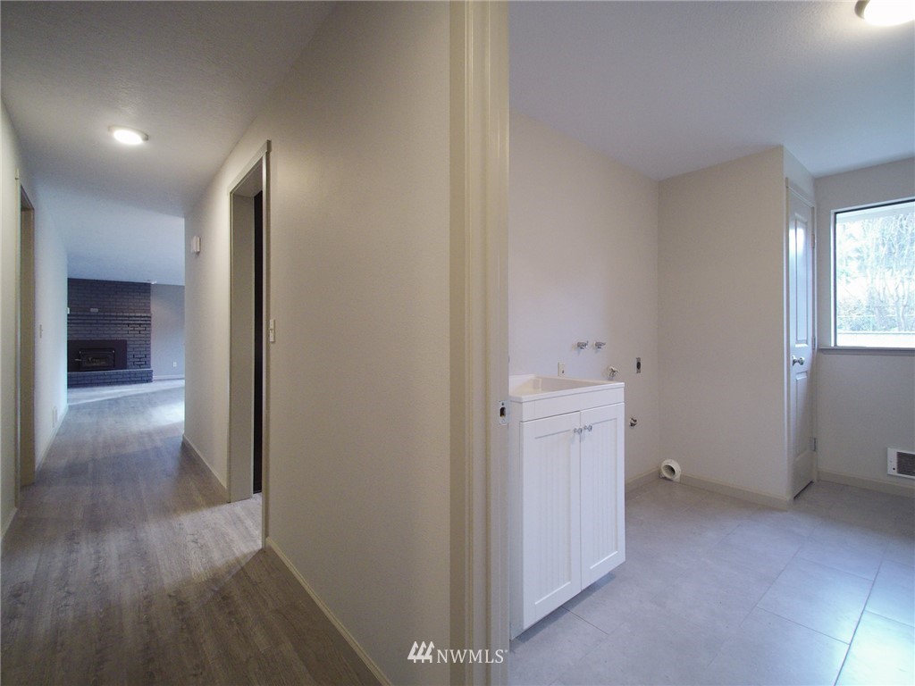 11 Starry Road Sequim, WA 98382 - Photo 14 of 25 a view of a hallway with closet and wooden floor