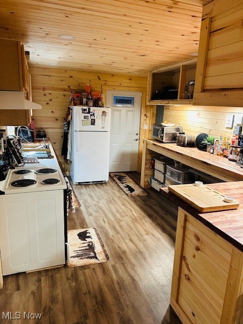 2445 McCord Hill Road Wellsburg, WV 26070 - Photo 16 of 37 Kitchen featuring wooden ceiling, white appliances, dark wood-style floors, wooden walls, and under cabinet range hood