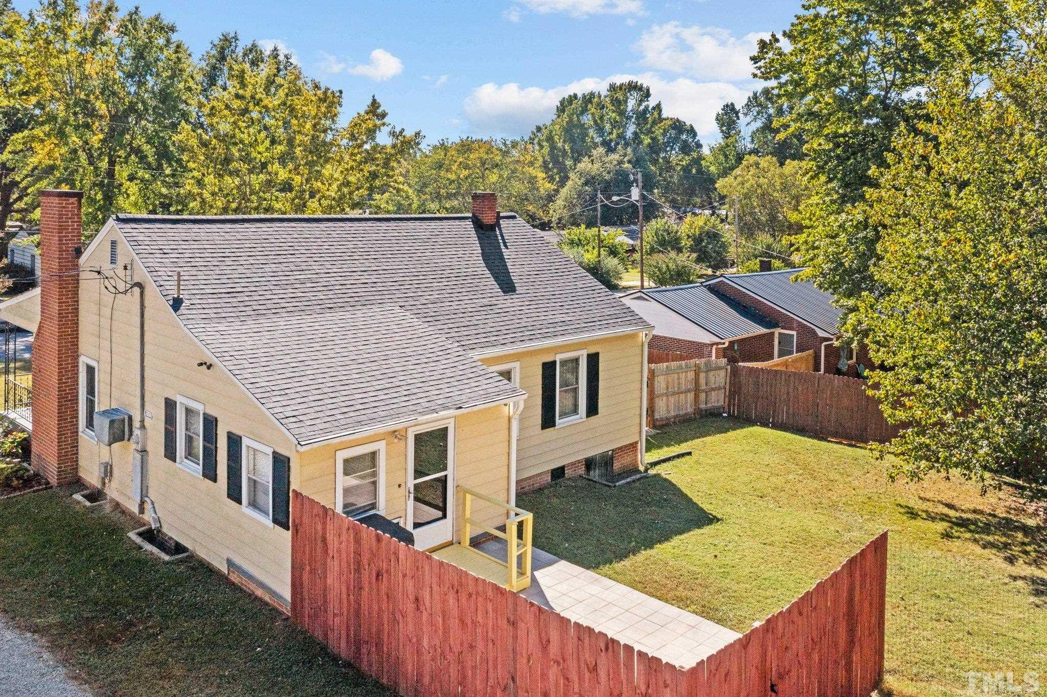 1253 Pointer Street Roxboro, NC 27573 - Photo 5 of 30 aerial view of a house with wooden fence