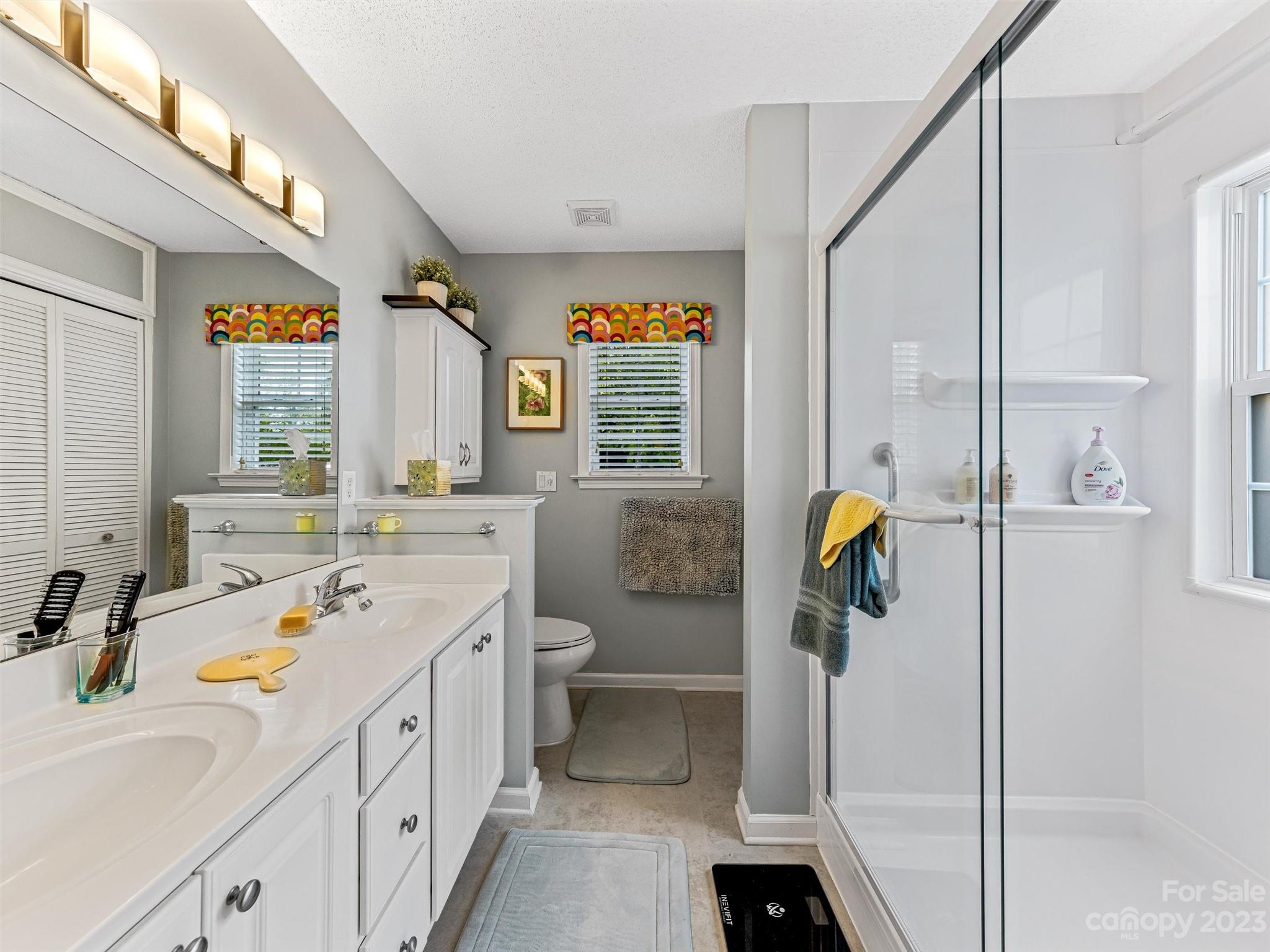 33 Black River Road Fletcher, NC 28732 - Photo 17 of 30 a bathroom with a granite countertop sink and a shower