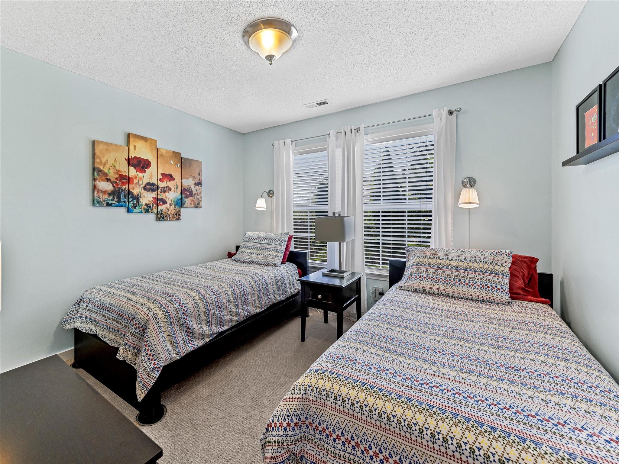 33 Black River Road Fletcher, NC 28732 - Photo 20 of 30 a bedroom with beds and a large window