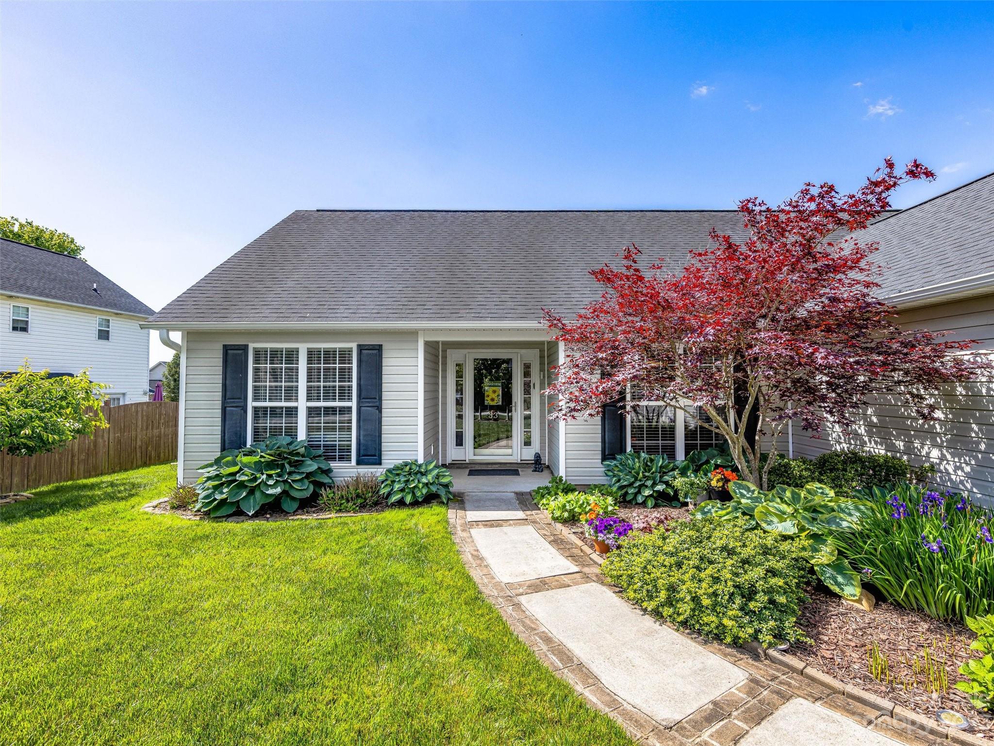 33 Black River Road Fletcher, NC 28732 - Photo 2 of 30 a front view of a house with garden