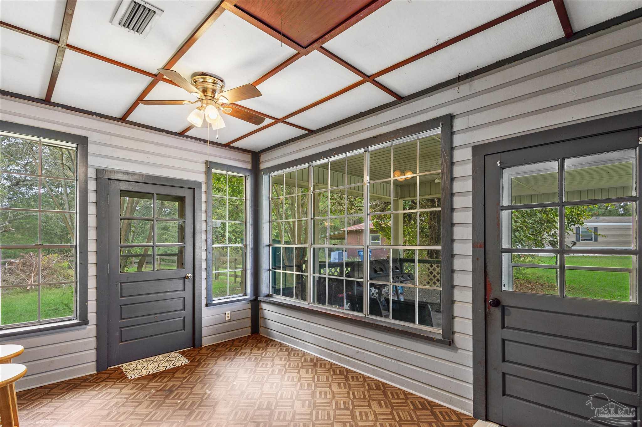 4176 Morristown Road Jay, FL 32565 - Photo 15 of 41 a view of a room with wooden floor and windows
