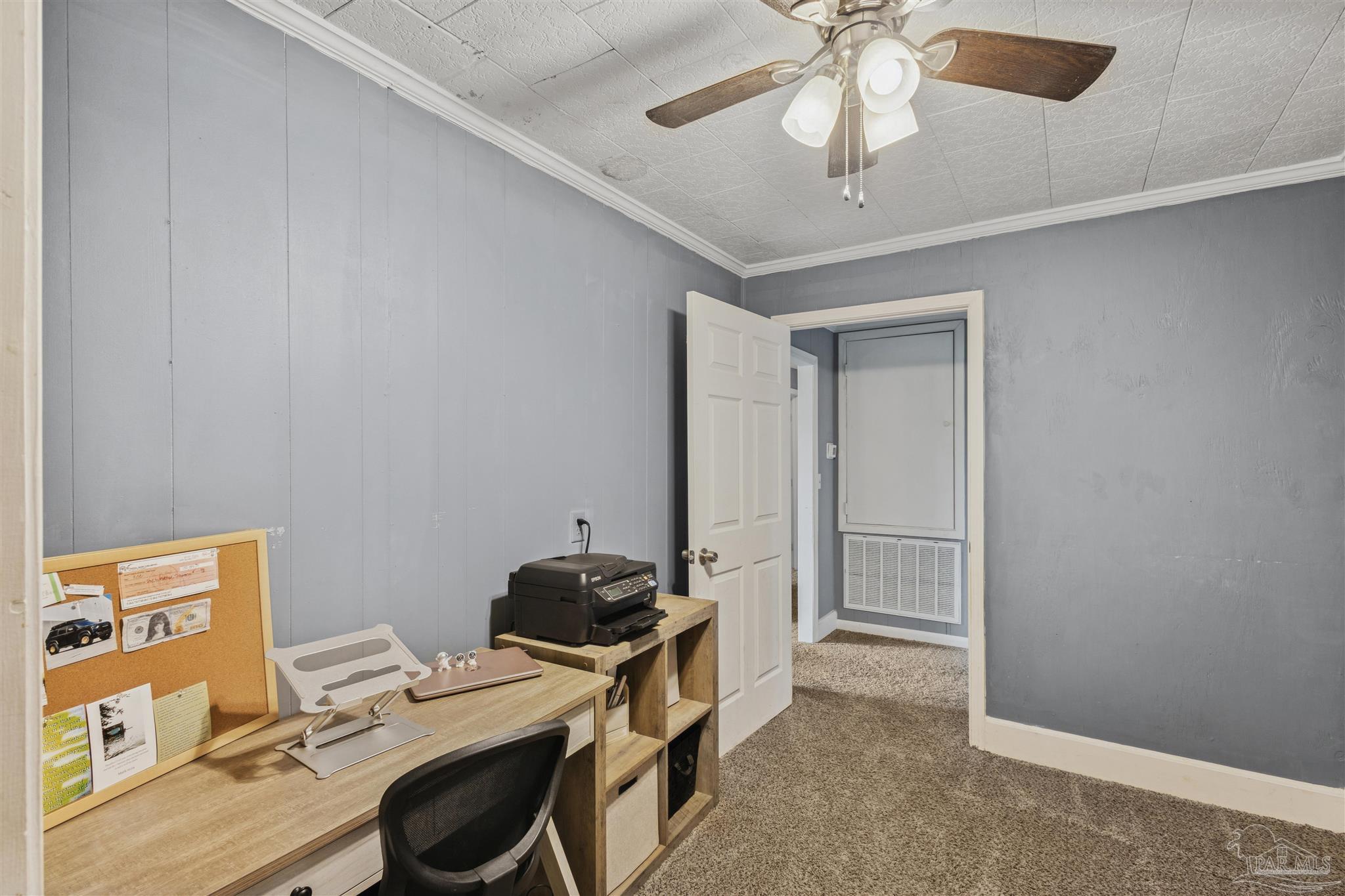 4176 Morristown Road Jay, FL 32565 - Photo 17 of 41 a room that has a bed and a chandelier