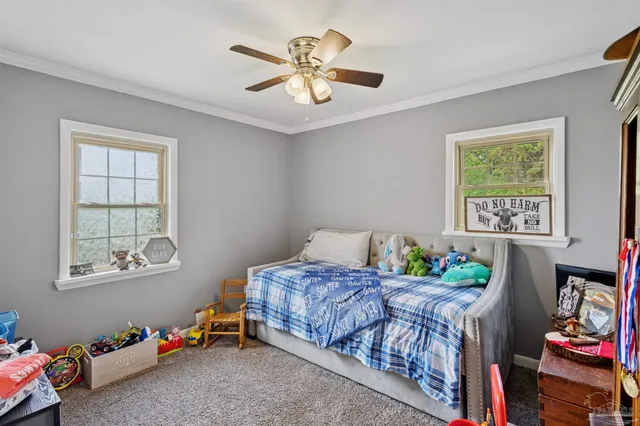 a bedroom that has a bed and a window