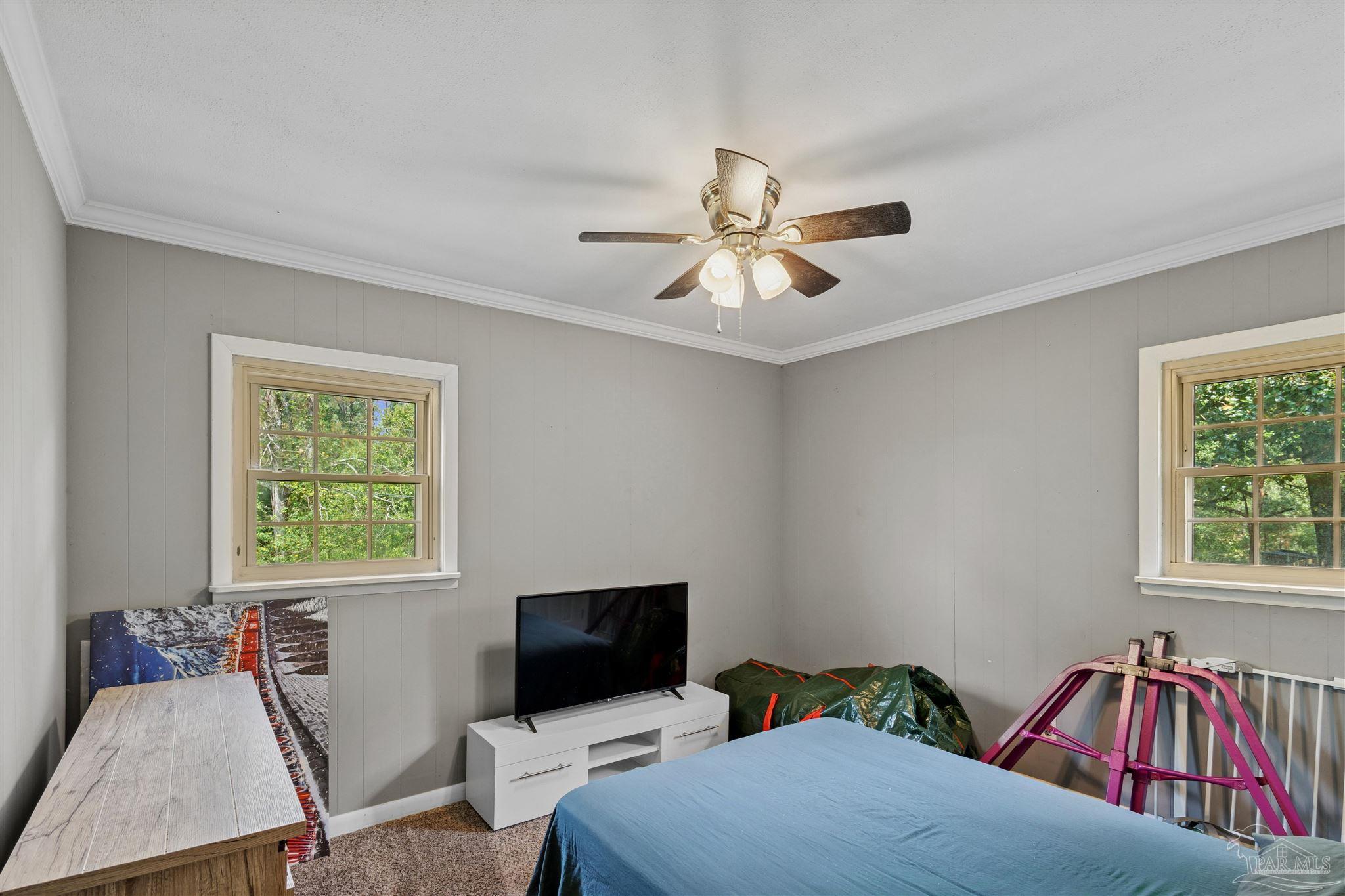 4176 Morristown Road Jay, FL 32565 - Photo 25 of 41 a bedroom with two beds and a window