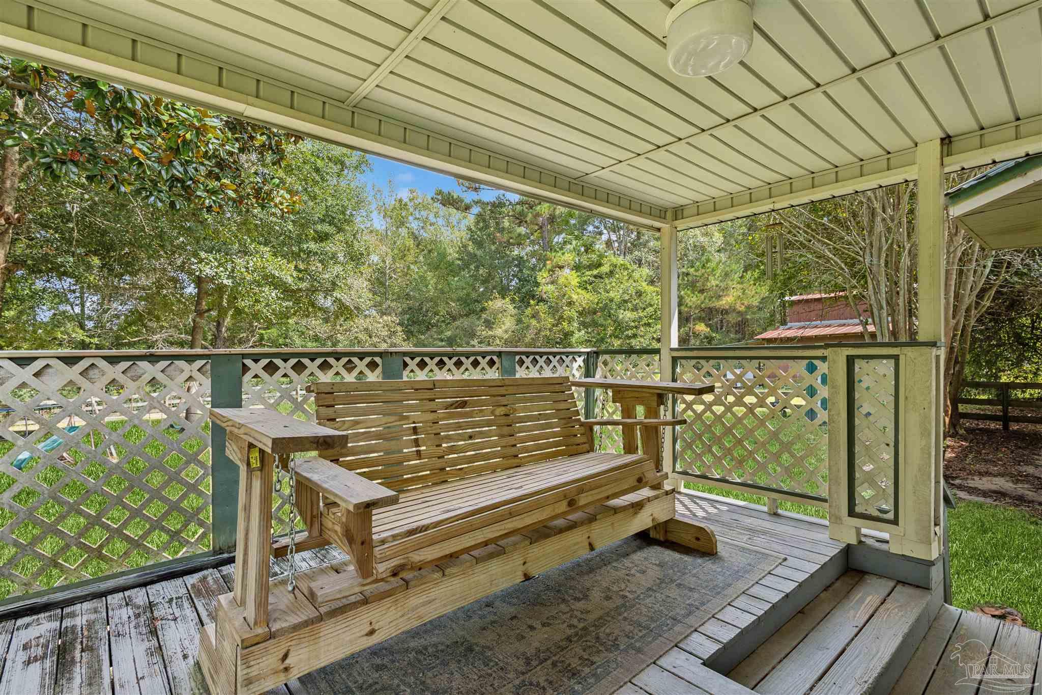 4176 Morristown Road Jay, FL 32565 - Photo 27 of 41 a roof deck with wooden floor