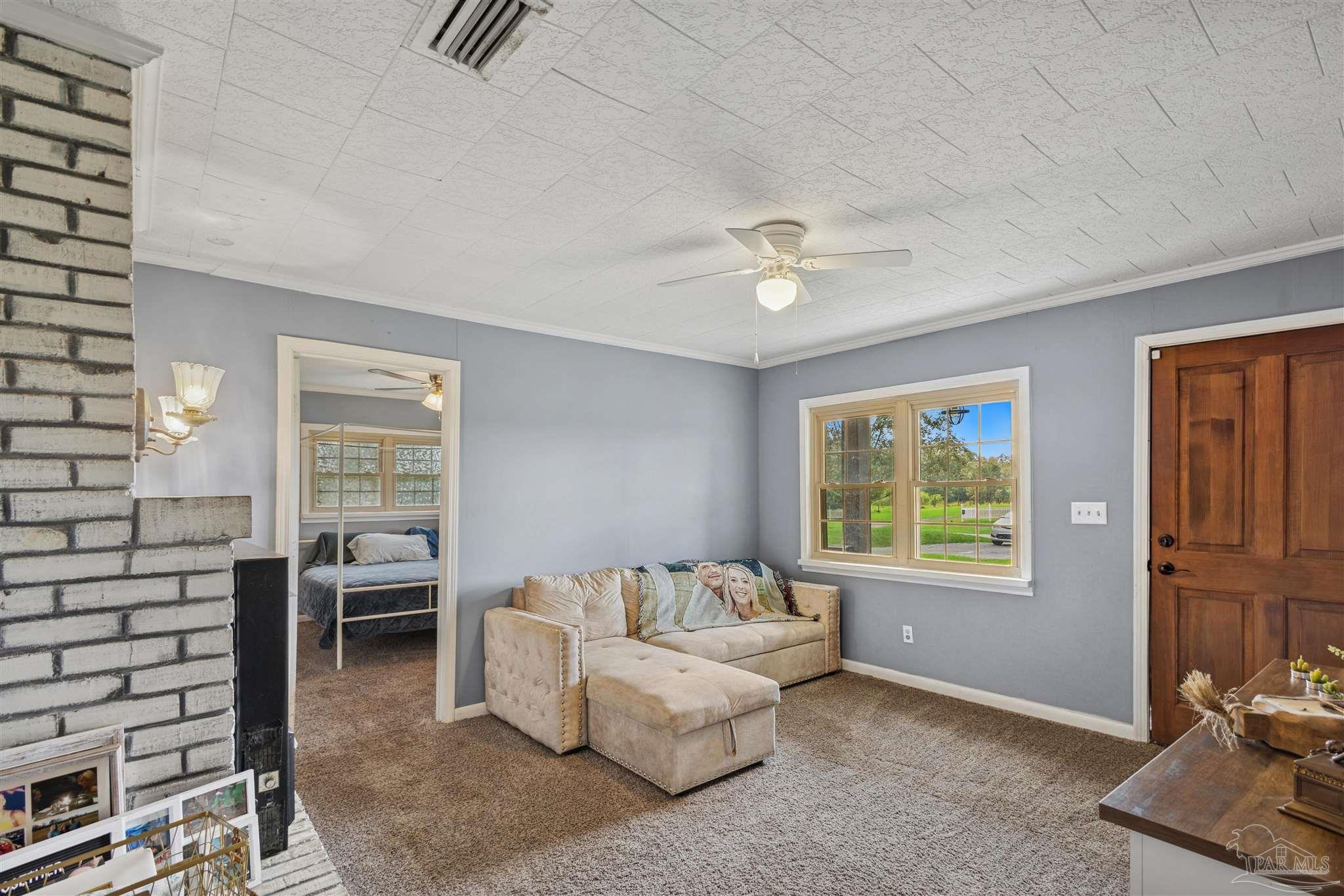 4176 Morristown Road Jay, FL 32565 - Photo 5 of 41 a living room with furniture and a window