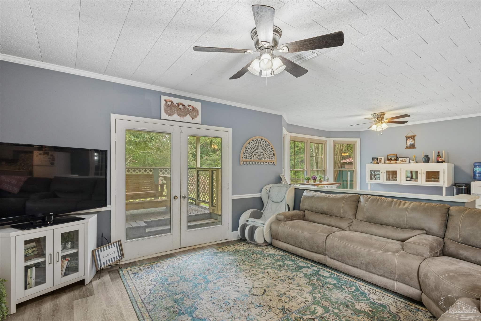 4176 Morristown Road Jay, FL 32565 - Photo 8 of 41 a living room with furniture and a flat screen tv