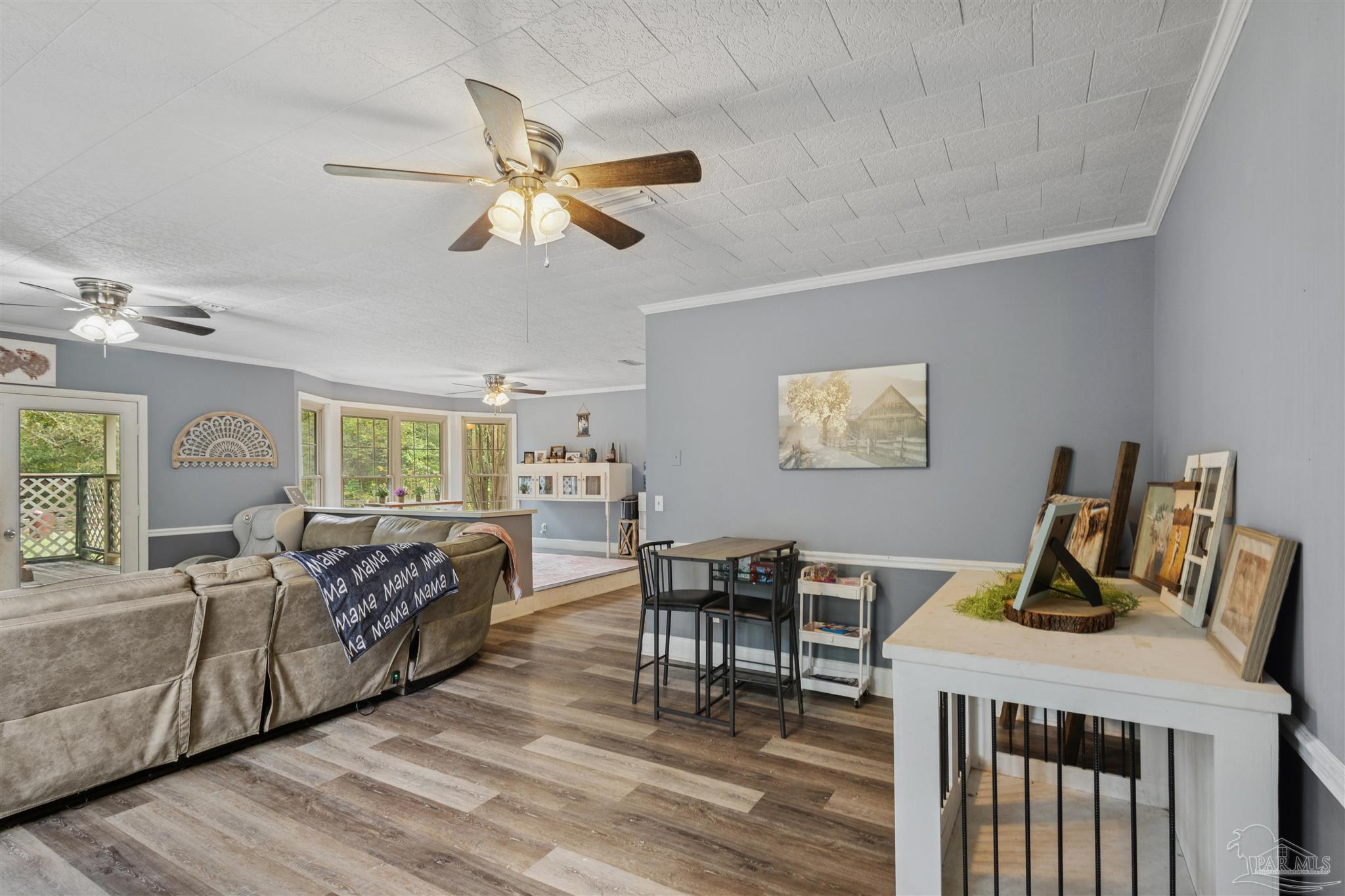 4176 Morristown Road Jay, FL 32565 - Photo 9 of 41 a living room with furniture and a wooden floor