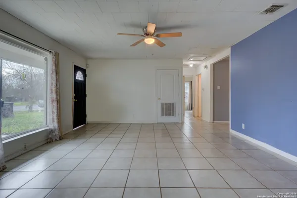 a view of an empty room with a window