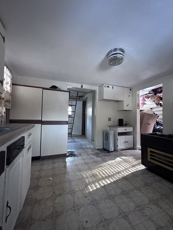 404 Sylvester Road Northampton, MA 01062 - Photo 3 of 5 a kitchen with stainless steel appliances a refrigerator and a stove top oven