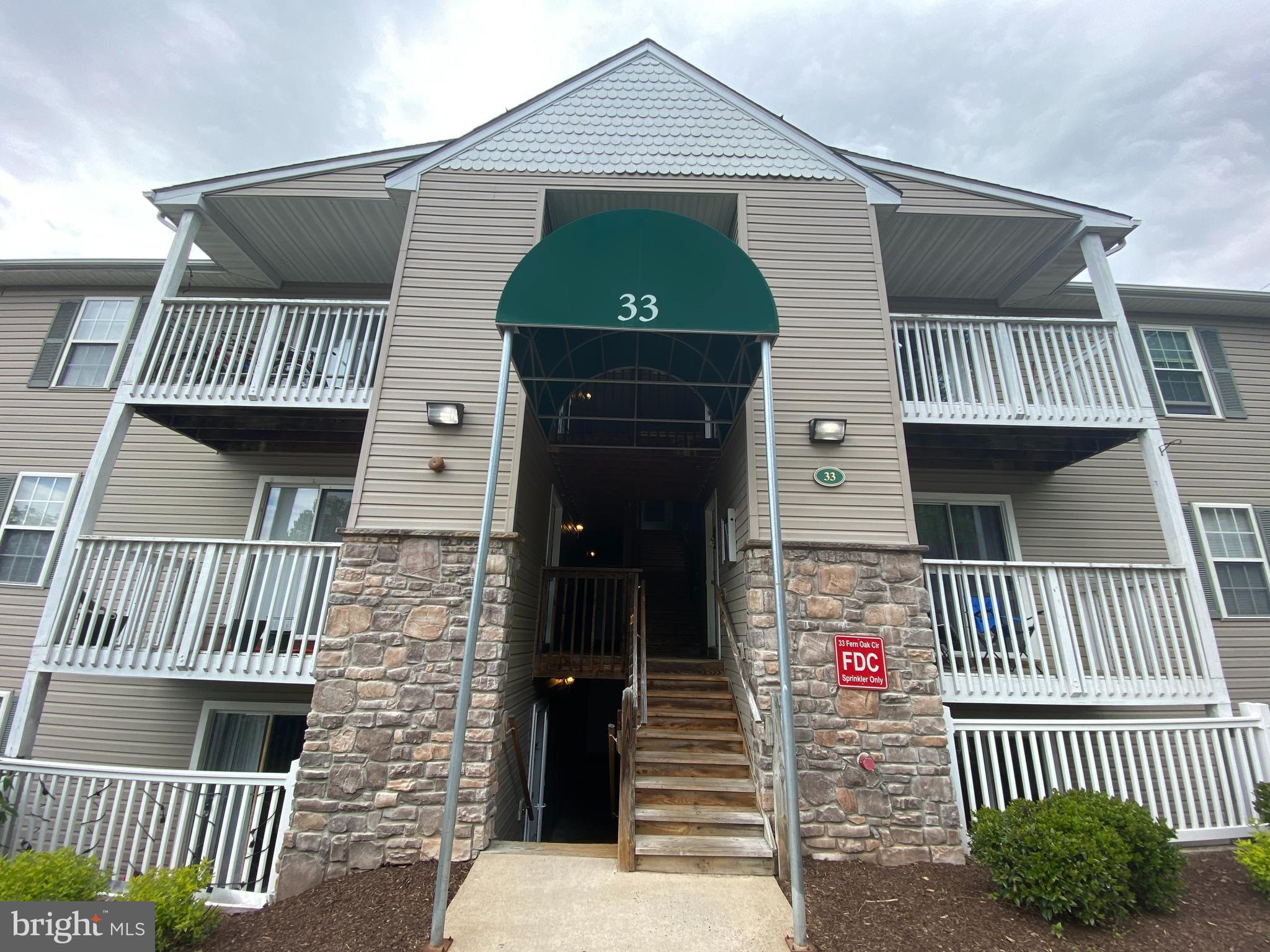 33 Fern Oak Circle, Unit 100 Stafford, VA 22554 - Photo 1 of 23 a front view of a house
