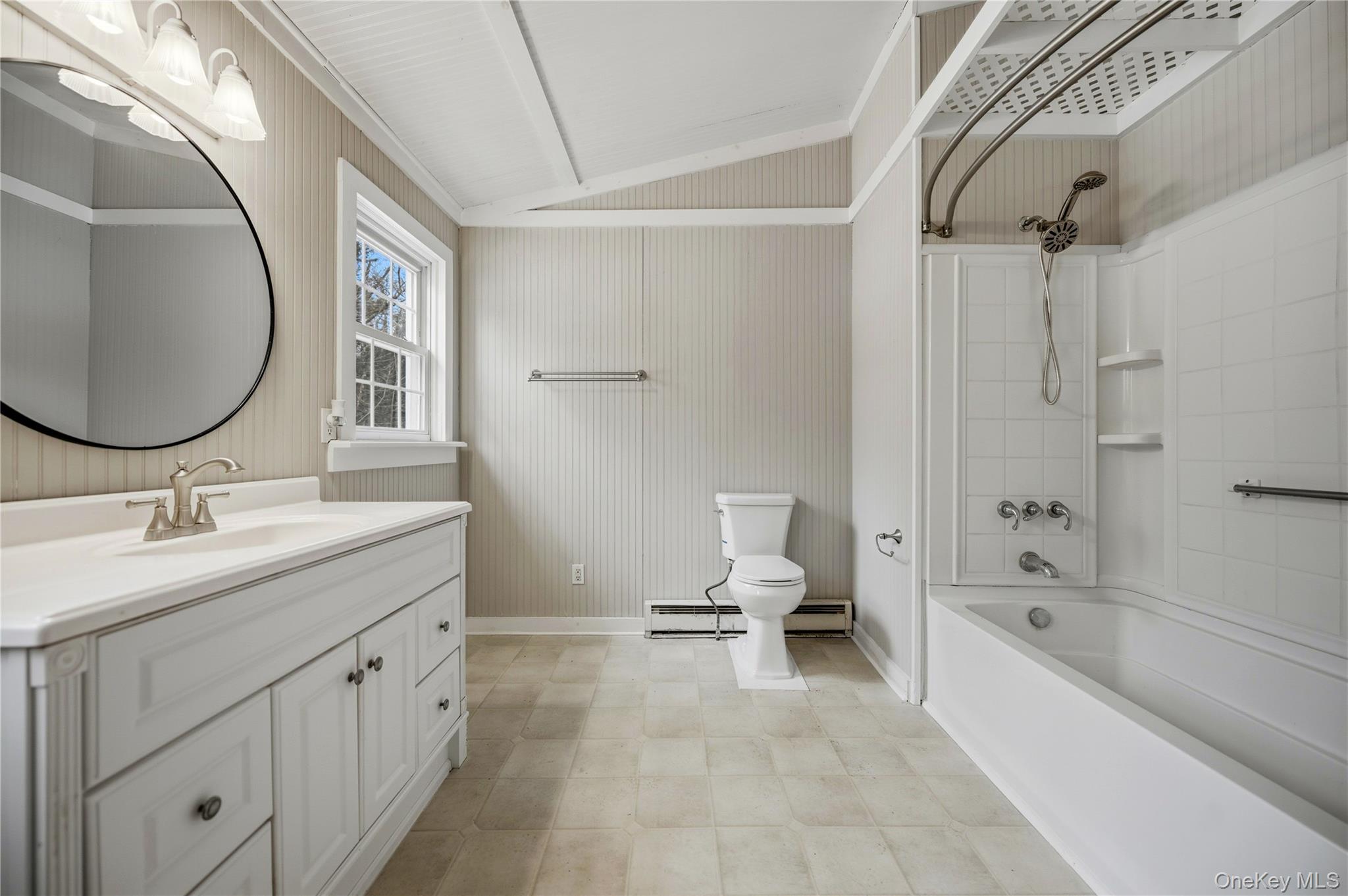 293 Highway 94 Warwick, NY 10990 - Photo 8 of 20 Bathroom with bathtub / shower combination, vanity, lofted ceiling, a baseboard heating unit, and a baseboard radiator