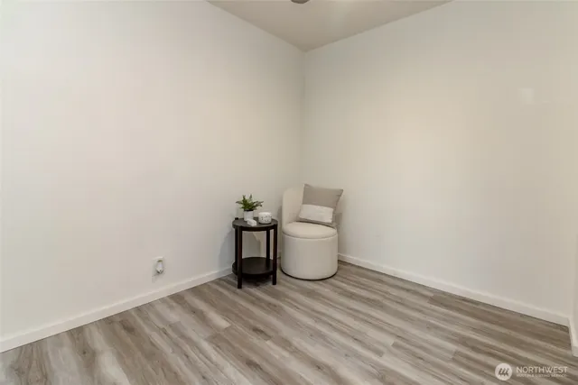 a view of a room with wooden floor