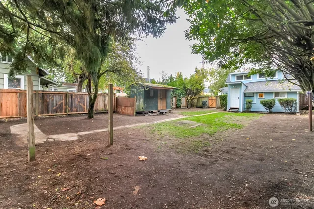 a view of house with outdoor space and tree s