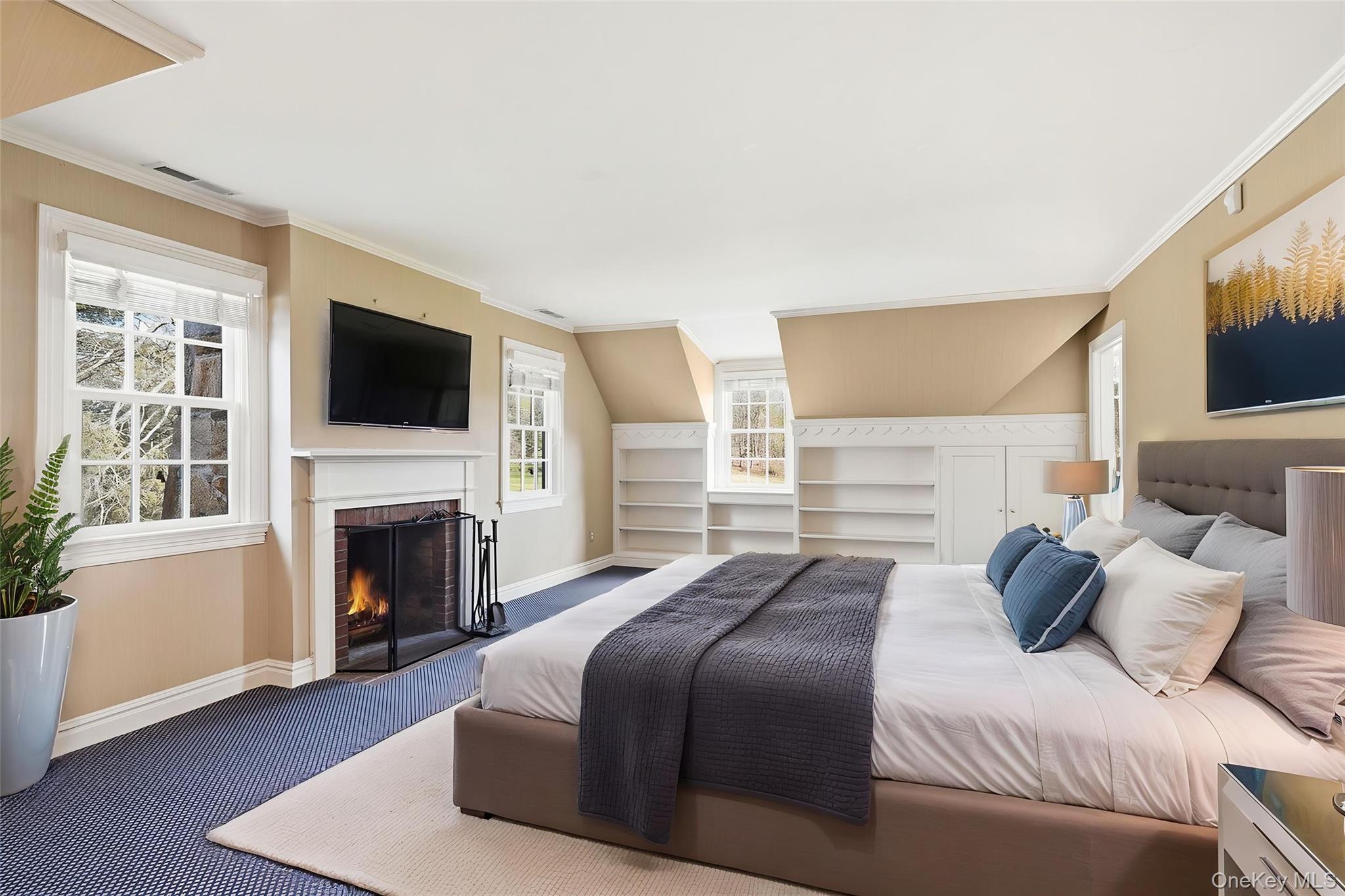 6 Club Road Rye, NY 10580 - Photo 13 of 26 a bedroom with a bed and a flat screen tv