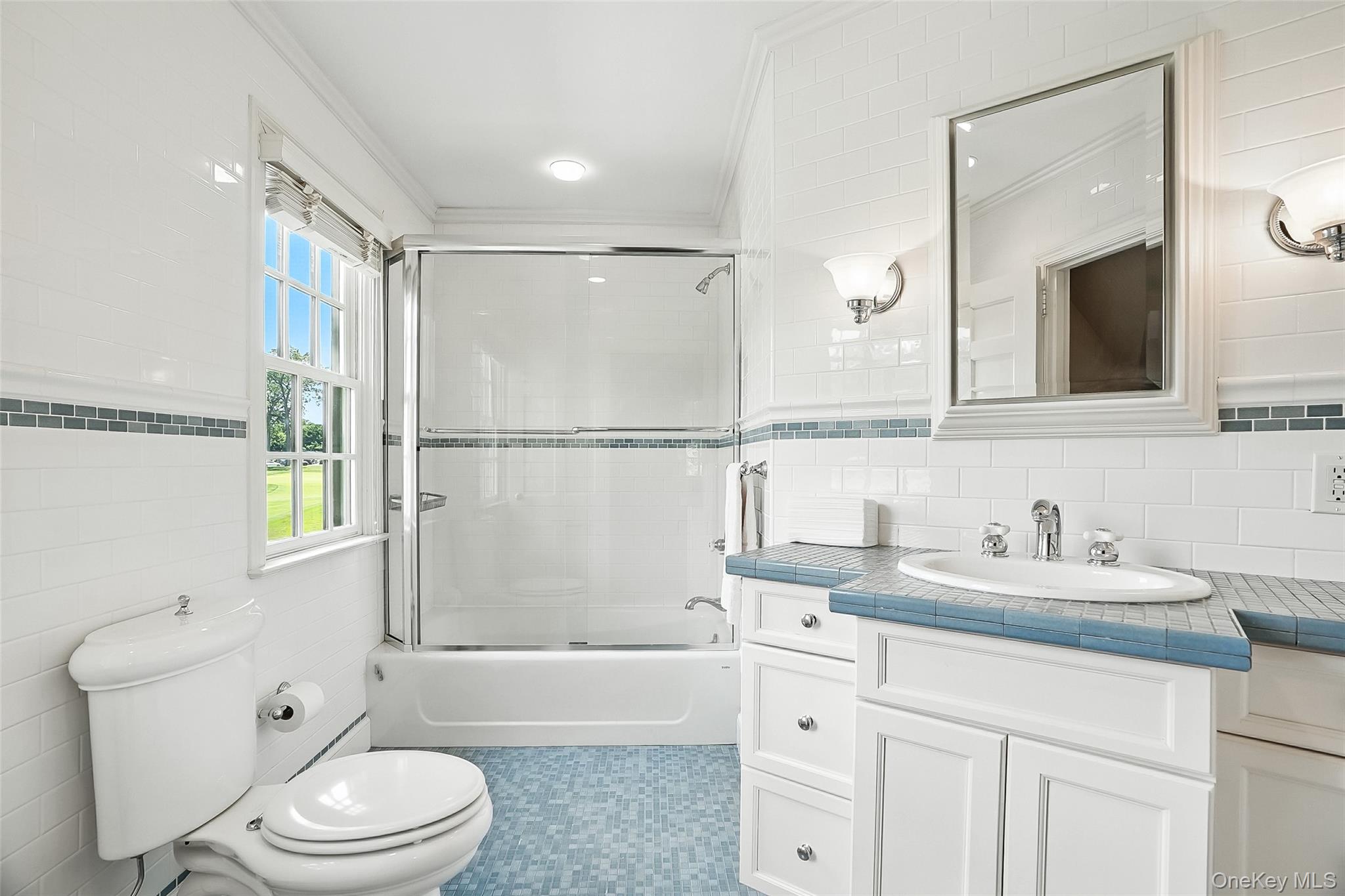 6 Club Road Rye, NY 10580 - Photo 14 of 26 a bathroom with a sink a toilet a mirror and shower