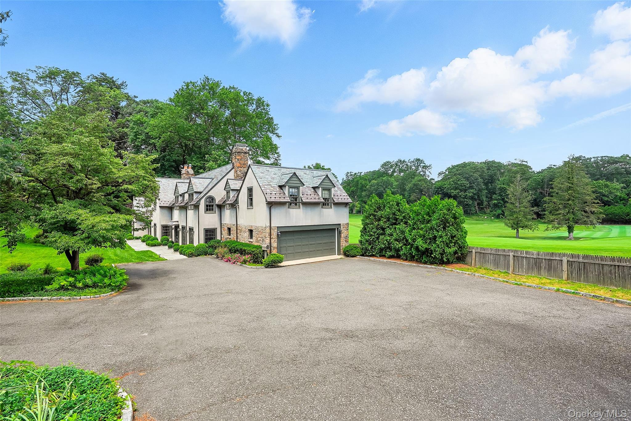 6 Club Road Rye, NY 10580 - Photo 21 of 26 a view of a house with a big yard plants and large trees