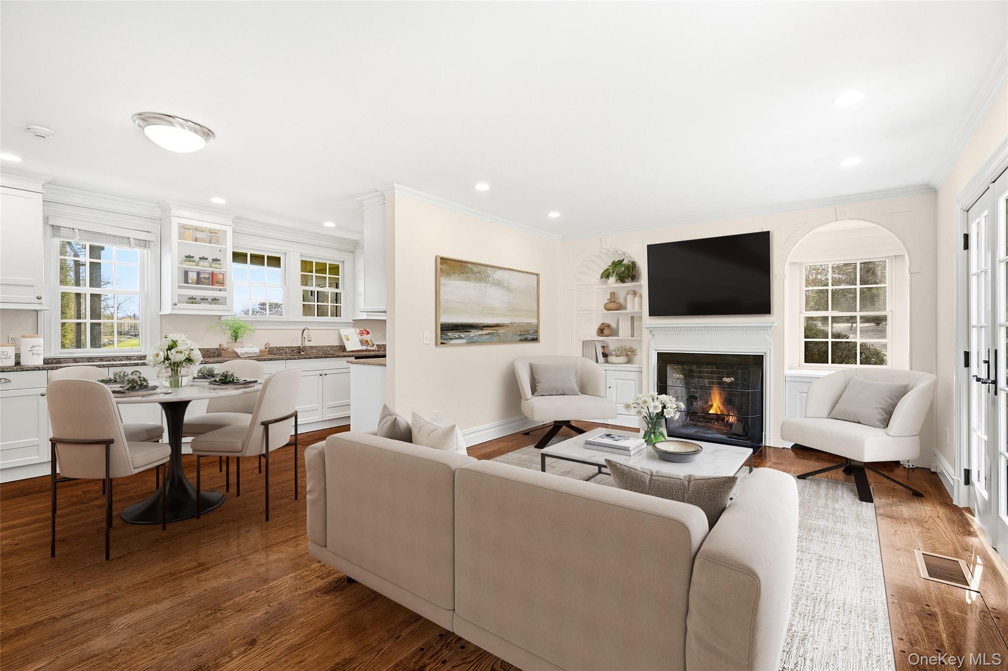 6 Club Road Rye, NY 10580 - Photo 6 of 26 a living room with furniture a fireplace and a flat screen tv