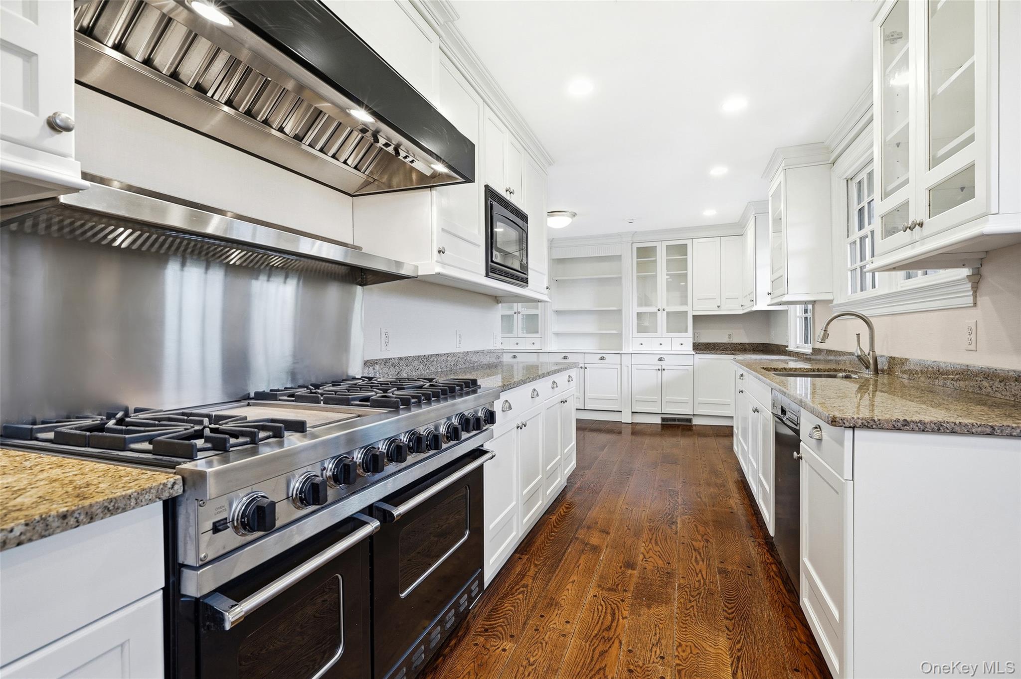 6 Club Road Rye, NY 10580 - Photo 7 of 26 a kitchen with stainless steel appliances granite countertop a stove and a sink