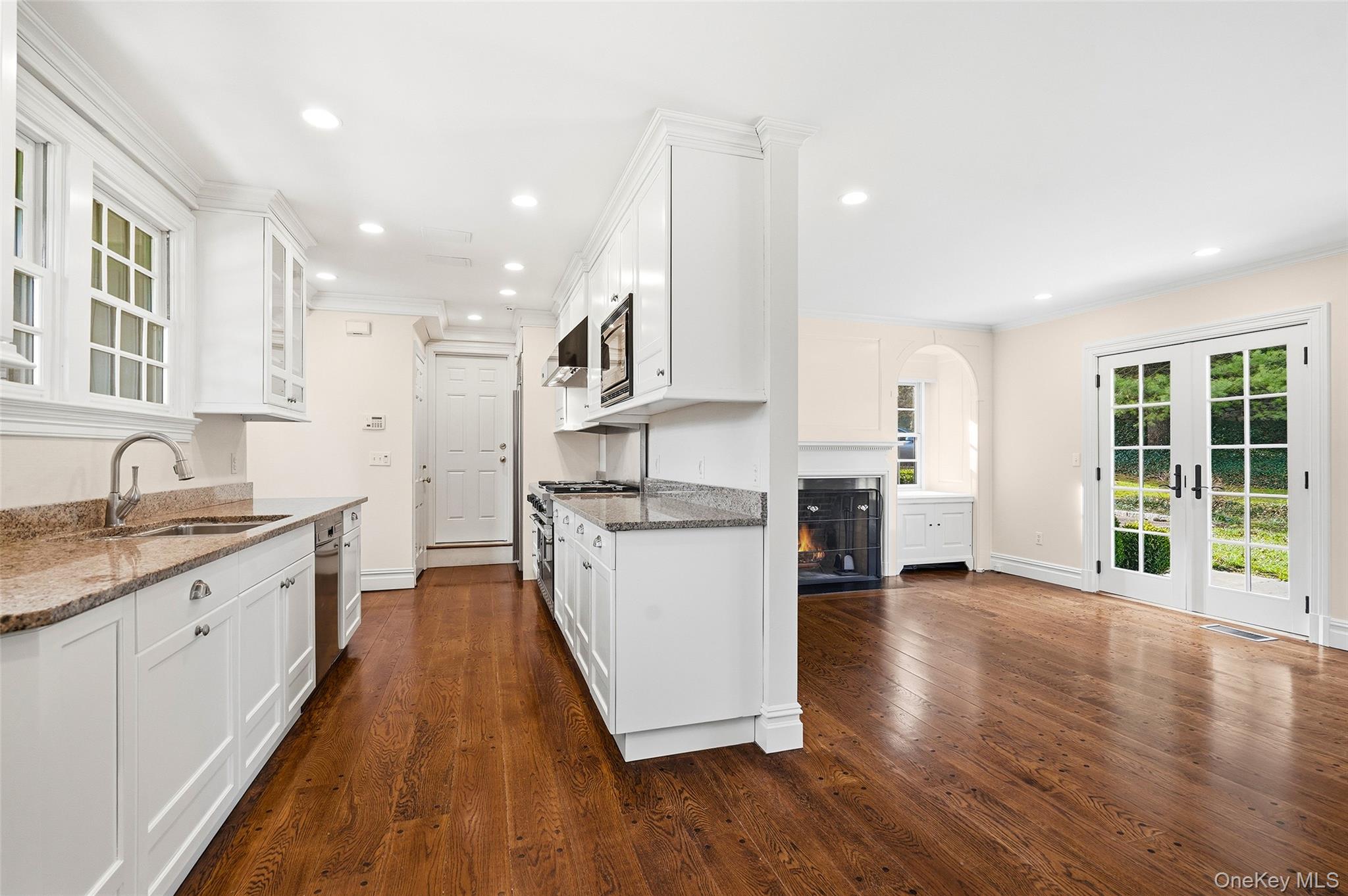 6 Club Road Rye, NY 10580 - Photo 8 of 26 a large kitchen with stainless steel appliances granite countertop a lot of counter space and wooden floors