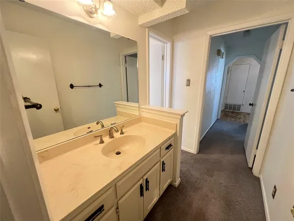 a bathroom with a sink and mirror