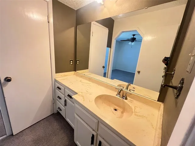 a bathroom with a double vanity sink and mirror