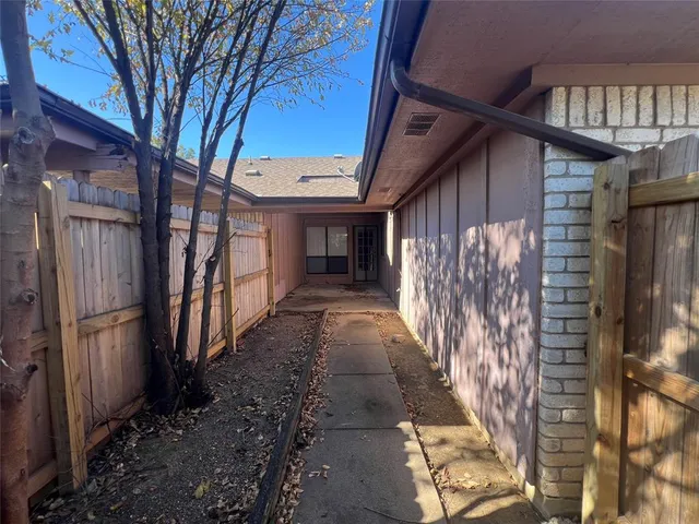 a view of a pathway with a house
