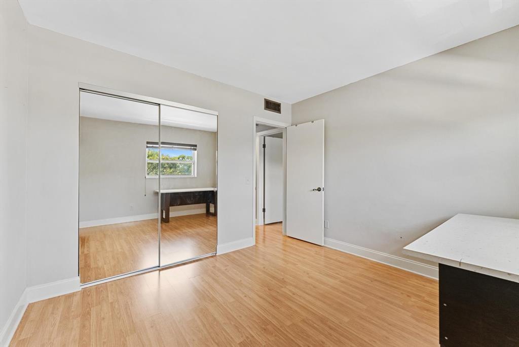 2451 Southwest 82nd Avenue, Unit 310 Davie, FL 33324 - Photo 11 of 21 a view of empty room with wooden floor