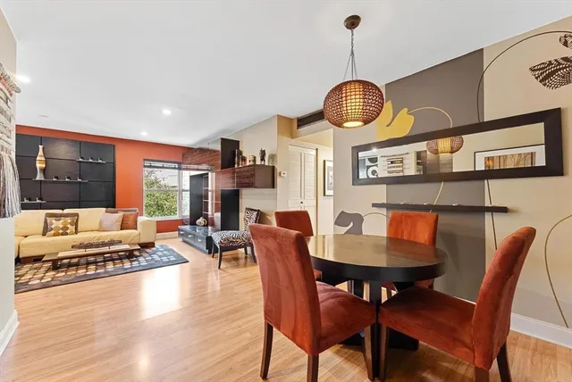 a view of a dining room with furniture window and wooden floor