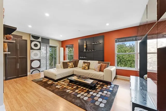 a living room with furniture and a large window