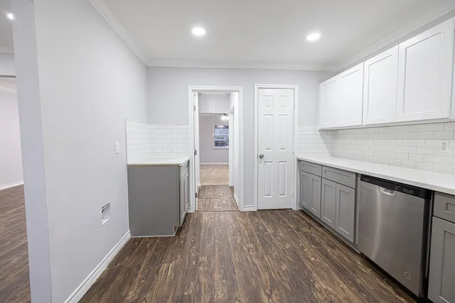 a view of a kitchen with wooden floor