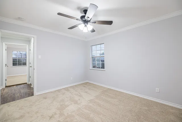 an empty room with fan