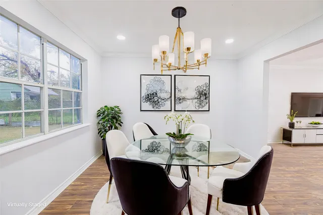 a dining room with furniture and window