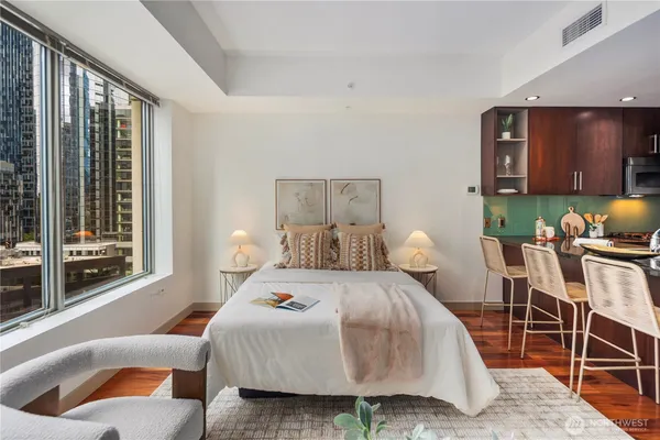 a view of a hallway with wooden floor fireplace and living room