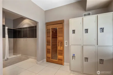a large kitchen with kitchen island a large counter space a sink and appliances