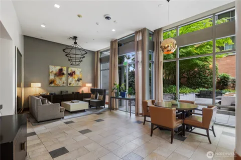 a view of a livingroom with furniture and a potted plant