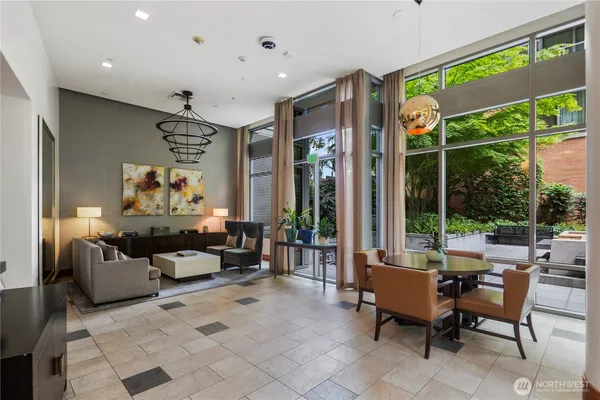 a view of a livingroom with furniture and a potted plant