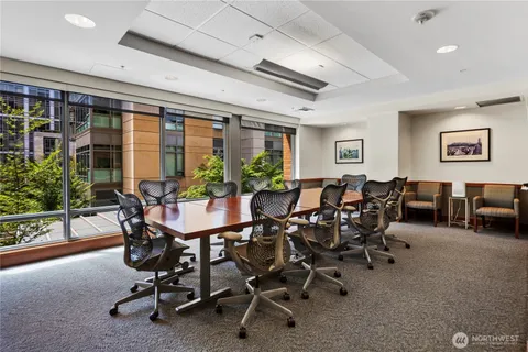 a room with furniture a air conditioner and pool table